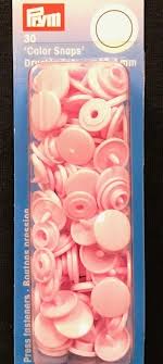 Pale pink snap buttons